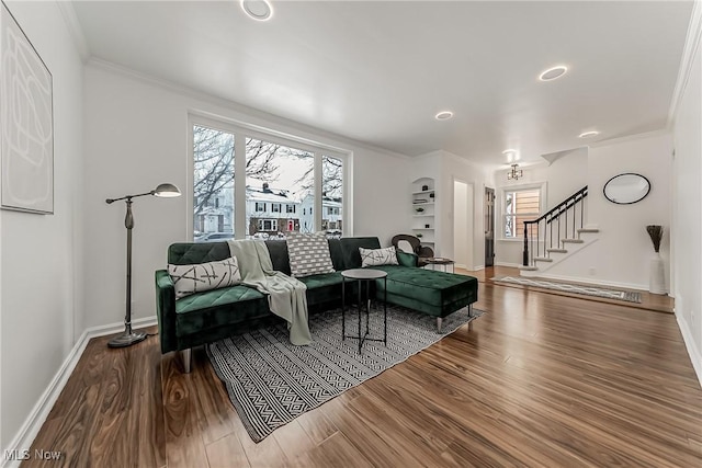4073 Bushnell Rd, University Heights, OH 44118 - living room featuring stairway, ornamental molding, baseboards, and plenty of natural light