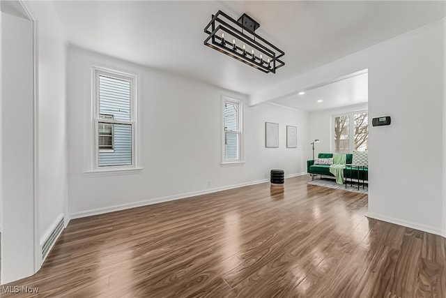 4073 Bushnell Rd, University Heights, OH 44118 - unfurnished living room with wood finished floors, healthy amount of natural light, recessed lighting, and baseboards