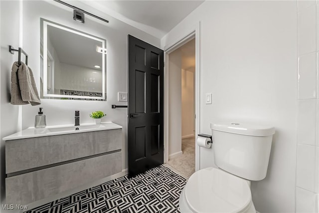 4073 Bushnell Rd, University Heights, OH 44118 - bathroom featuring toilet, vanity, and baseboards