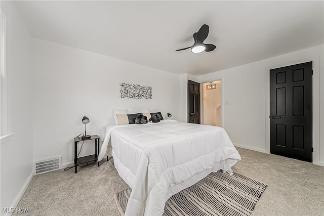 4073 Bushnell Rd, University Heights, OH 44118 - bedroom with light carpet, baseboards, and a ceiling fan