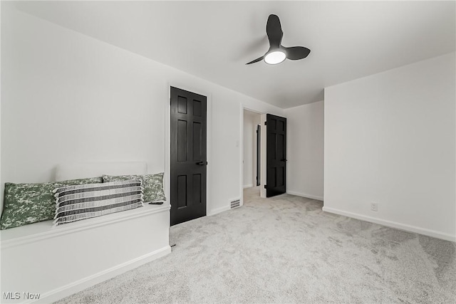 4073 Bushnell Rd, University Heights, OH 44118 - unfurnished bedroom featuring carpet floors, baseboards, and a ceiling fan