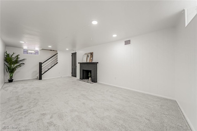 4073 Bushnell Rd, University Heights, OH 44118 - basement with carpet floors, a fireplace, recessed lighting, stairs, and baseboards