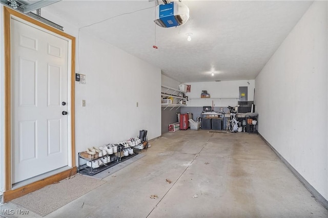651 Sturbridge Dr, Medina, OH 44256 - garage featuring a garage door opener and electric panel