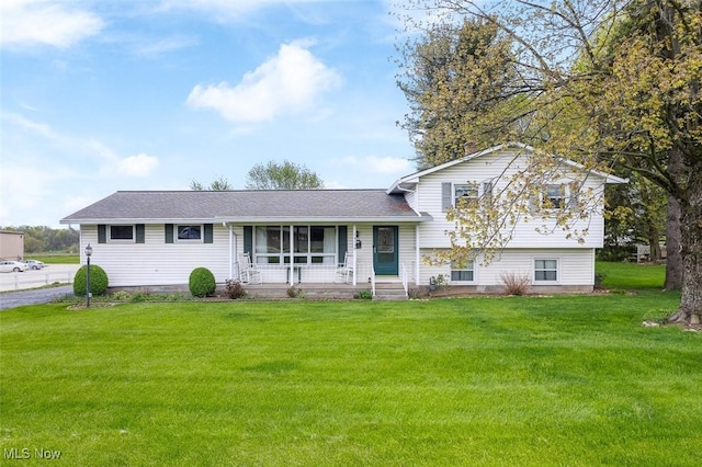 16139 E Main St, Mount Eaton, OH 44659 - split level home featuring covered porch, a front yard, and a shingled roof