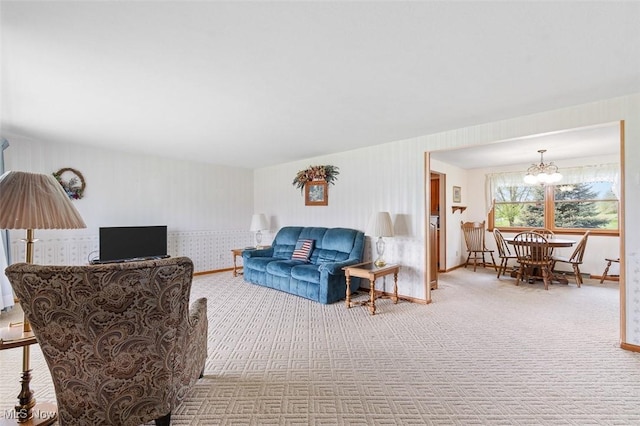 16139 E Main St, Mount Eaton, OH 44659 - carpeted living room with a chandelier, wallpapered walls, and baseboards