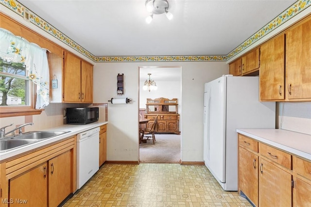 16139 E Main St, Mount Eaton, OH 44659 - kitchen featuring white appliances, a sink, light flooring, and light countertops