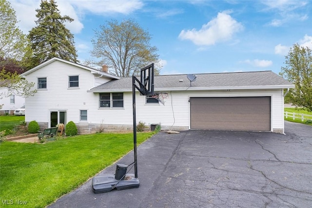 16139 E Main St, Mount Eaton, OH 44659 - view of front of property featuring a front lawn, driveway, a garage, and a shingled roof
