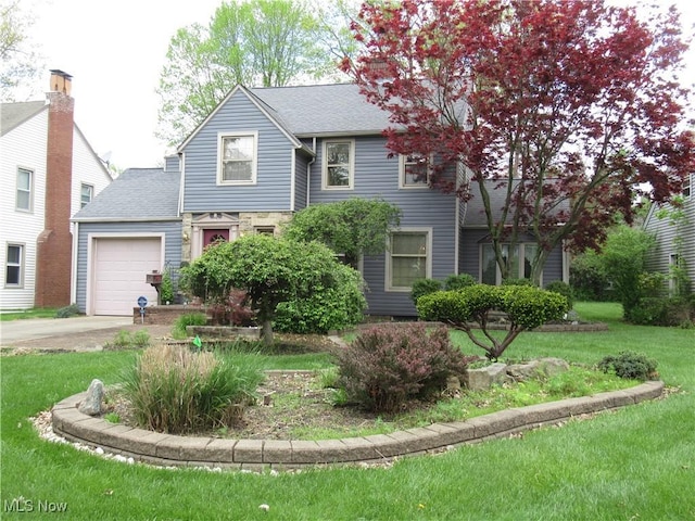 64 S Cadillac Dr, Boardman, OH 44512 - view of front facade featuring an attached garage, driveway, a front lawn, and a shingled roof