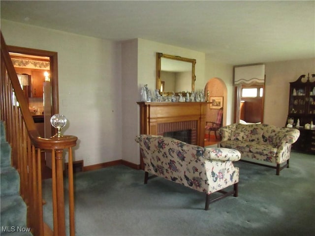 64 S Cadillac Dr, Boardman, OH 44512 - living area with carpet, stairs, a brick fireplace, and baseboards