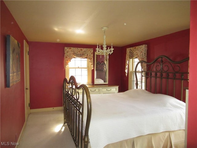 64 S Cadillac Dr, Boardman, OH 44512 - carpeted bedroom featuring baseboards and a chandelier