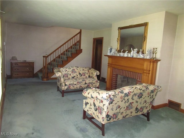 64 S Cadillac Dr, Boardman, OH 44512 - living room featuring carpet, stairway, a brick fireplace, and baseboards