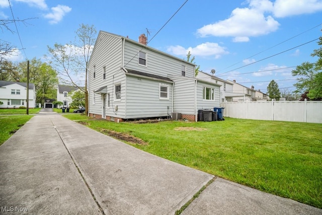3843 Bendemeer Rd, Cleveland Heights, OH 44118 - back of house featuring a chimney and central AC