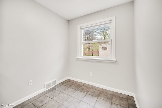 3843 Bendemeer Rd, Cleveland Heights, OH 44118 - unfurnished room featuring baseboards and light tile patterned flooring