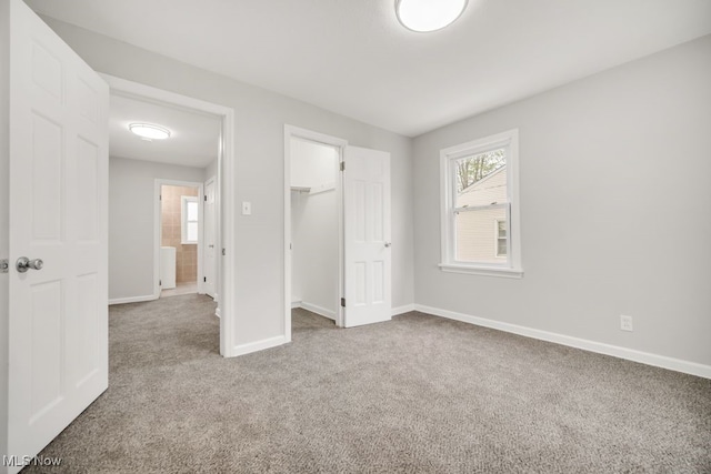 3843 Bendemeer Rd, Cleveland Heights, OH 44118 - unfurnished bedroom with carpet, baseboards, multiple windows, and a closet