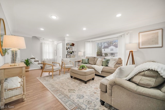 3843 Bendemeer Rd, Cleveland Heights, OH 44118 - living area with stairs, light wood-style flooring, recessed lighting, and baseboards