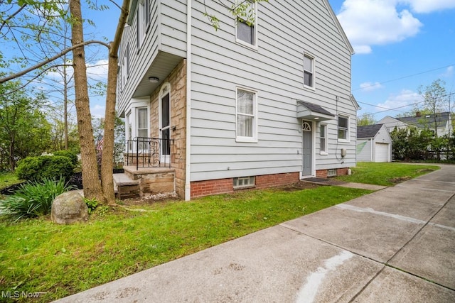 3843 Bendemeer Rd, Cleveland Heights, OH 44118 - view of home's exterior featuring a lawn and a garage