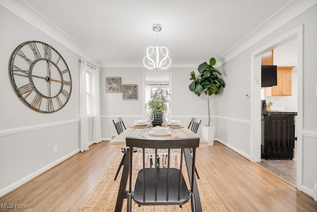 3843 Bendemeer Rd, Cleveland Heights, OH 44118 - dining room with a chandelier, light wood-style floors, and baseboards