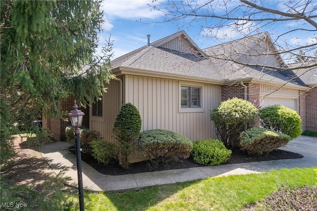 489 Paul Tell Trl, Tallmadge, OH 44278 - view of home's exterior featuring roof with shingles and a garage