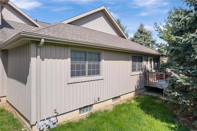 489 Paul Tell Trl, Tallmadge, OH 44278 - view of side of home with roof with shingles, a deck, and a yard