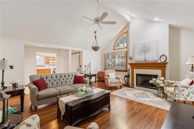 489 Paul Tell Trl, Tallmadge, OH 44278 - living room featuring a ceiling fan, high vaulted ceiling, beamed ceiling, wood finished floors, and a fireplace