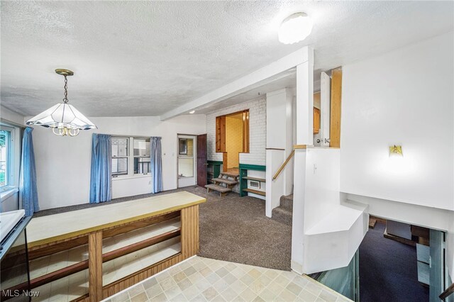 3509 Fargo Dr, Ashtabula, OH 44004 - carpeted foyer entrance featuring a textured ceiling and a chandelier