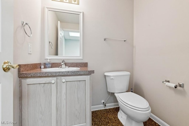 1250 Spring Ridge Cir, Alliance, OH 44601 - half bath with toilet, vanity, and baseboards