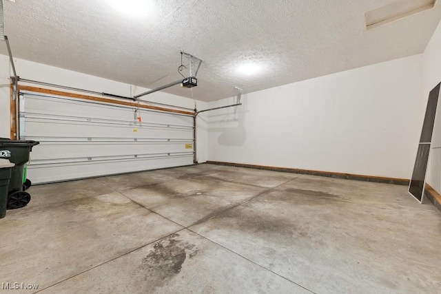 1250 Spring Ridge Cir, Alliance, OH 44601 - garage with a garage door opener and baseboards