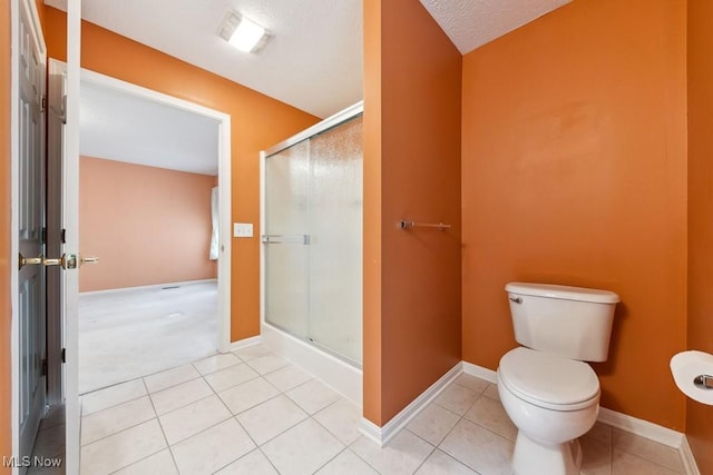 1250 Spring Ridge Cir, Alliance, OH 44601 - full bath with tile patterned floors, a shower stall, toilet, and baseboards