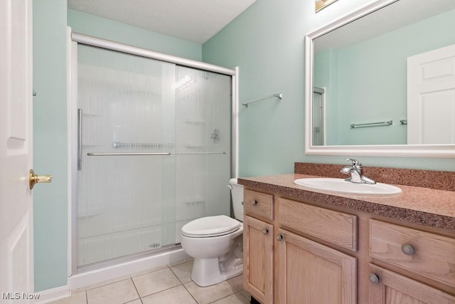 1250 Spring Ridge Cir, Alliance, OH 44601 - full bathroom with toilet, vanity, a shower stall, and tile patterned flooring