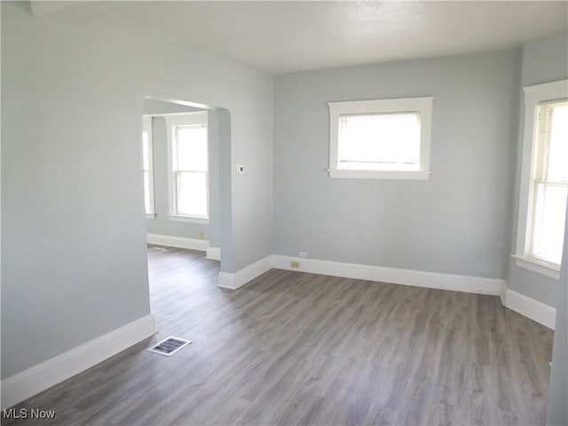 2067 W 105th St, Cleveland, OH 44102 - spare room featuring wood finished floors and baseboards
