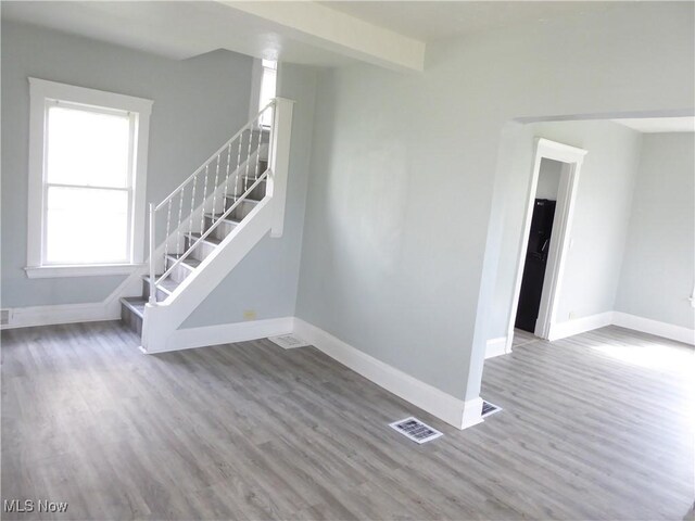 2067 W 105th St, Cleveland, OH 44102 - stairway featuring baseboards and wood finished floors