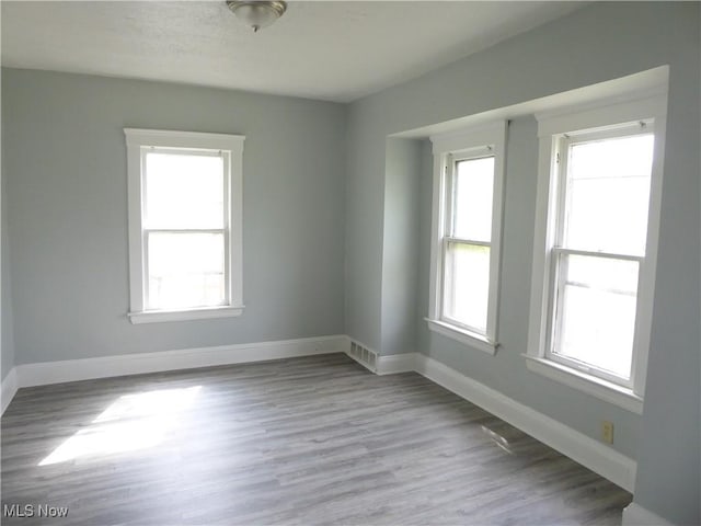 2067 W 105th St, Cleveland, OH 44102 - spare room featuring wood finished floors and baseboards