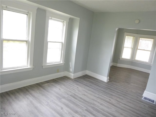 2067 W 105th St, Cleveland, OH 44102 - unfurnished room featuring wood finished floors, baseboards, and a smoke detector