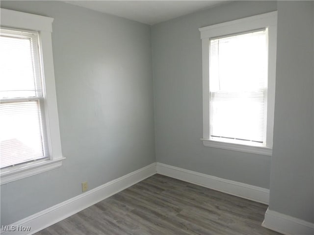 2067 W 105th St, Cleveland, OH 44102 - unfurnished room featuring healthy amount of natural light and dark wood finished floors