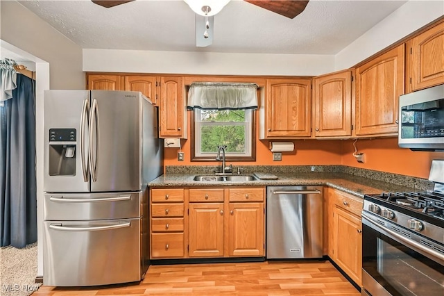 804 Cynthia Ct, Niles, OH 44446 - kitchen featuring appliances with stainless steel finishes, a sink, ceiling fan, and brown cabinets