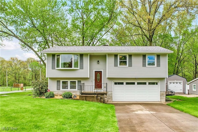 804 Cynthia Ct, Niles, OH 44446 - bi-level home featuring a front yard, a garage, and concrete driveway