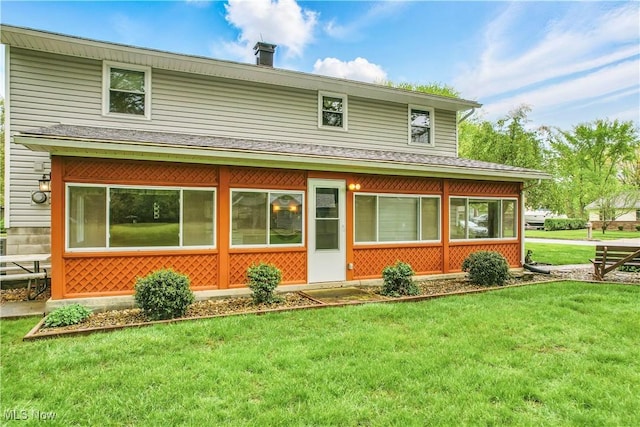 804 Cynthia Ct, Niles, OH 44446 - rear view of property featuring a yard, a chimney, a sunroom, and roof with shingles