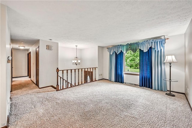 804 Cynthia Ct, Niles, OH 44446 - carpeted spare room featuring a textured ceiling, a chandelier, and baseboards