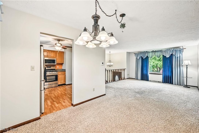 804 Cynthia Ct, Niles, OH 44446 - unfurnished living room featuring a chandelier, light carpet, baseboards, and ceiling fan