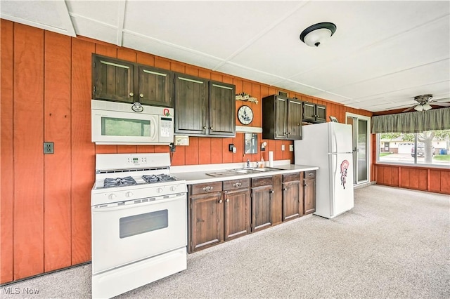 804 Cynthia Ct, Niles, OH 44446 - kitchen featuring white appliances, wooden walls, a sink, a ceiling fan, and light countertops