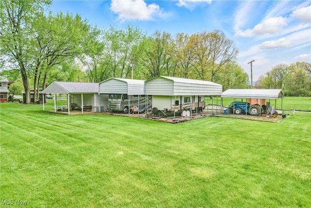804 Cynthia Ct, Niles, OH 44446 - rear view of property with a carport and a lawn