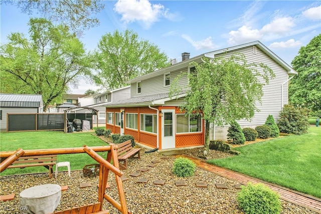 804 Cynthia Ct, Niles, OH 44446 - back of property featuring a sunroom and a chimney