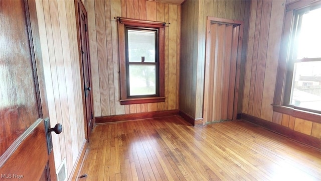 1632 Lawrence St, Parkersburg, WV 26101 - unfurnished room with light wood-style floors, wood walls, and baseboards