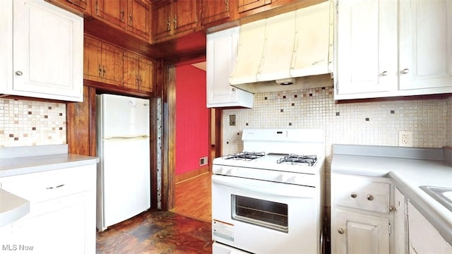 1632 Lawrence St, Parkersburg, WV 26101 - kitchen featuring white appliances, light countertops, decorative backsplash, and white cabinetry