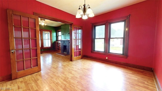 1632 Lawrence St, Parkersburg, WV 26101 - unfurnished dining area with a chandelier, light wood-type flooring, and plenty of natural light