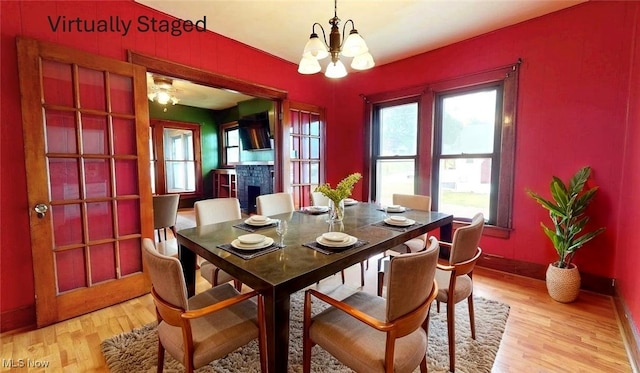 1632 Lawrence St, Parkersburg, WV 26101 - dining area with a chandelier, light wood-type flooring, and plenty of natural light