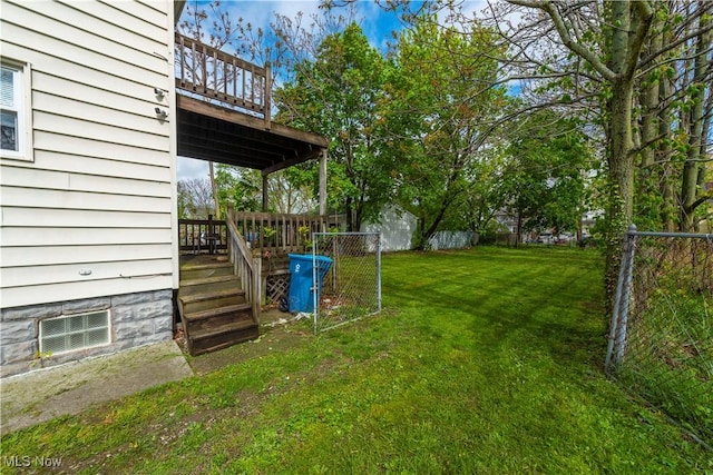 view of yard with a balcony, a deck, and an outdoor structure
