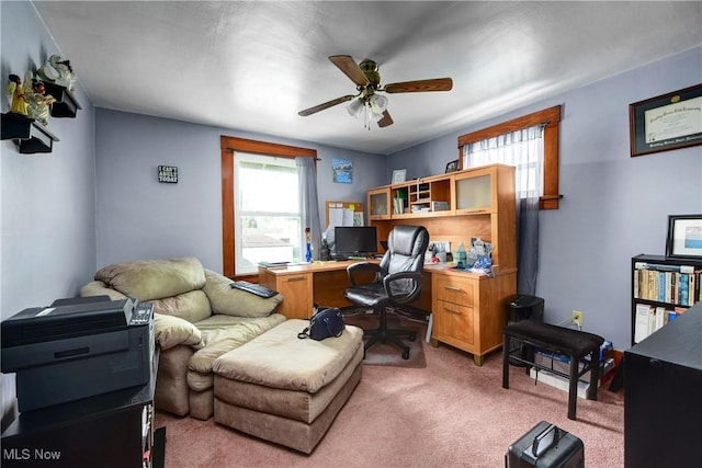 office area with light carpet and ceiling fan