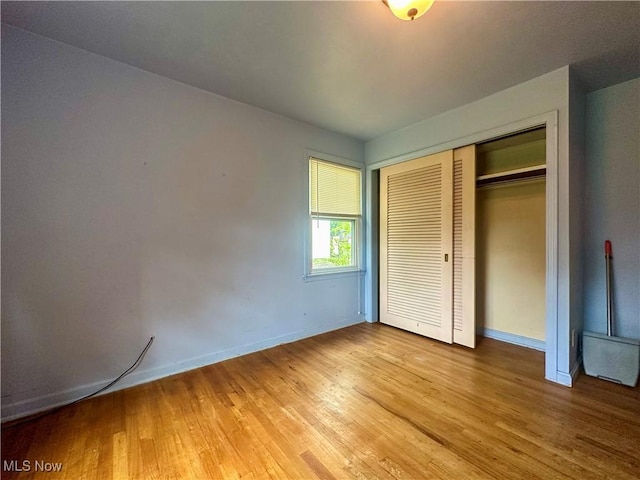 1357 Kearney St, Niles, OH 44446 - unfurnished bedroom with light wood-type flooring, baseboards, and a closet