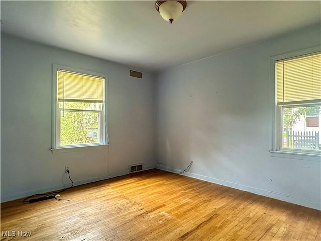 1357 Kearney St, Niles, OH 44446 - empty room with light wood-style floors, healthy amount of natural light, and baseboards